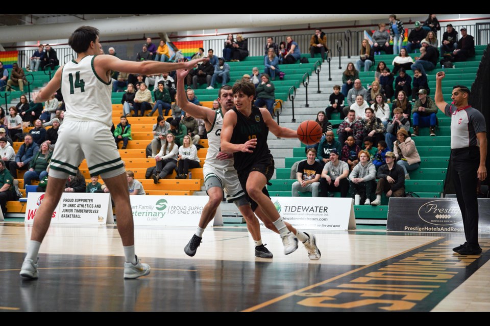 UNBC Timberwolves forward Evgeny Baukin drives to the net during Saturday's Canada West men's basketball clash with the Fraser Valley Cascades  at the NSC.