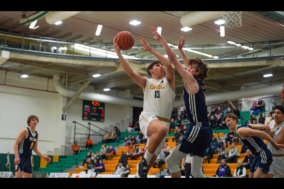 UNBC forward Evgeny Baukin launches the opening drive for the TWolves during their game Saturday (Jan. 18, 2025) at Brownridge Court against the Trinity Western University Spartans.