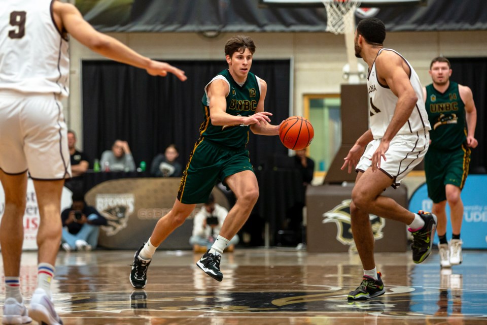 UNBC guard Evgeny Baukin moves the ball up the court against the Manitoba Bisons in last season's Canada West quarterfinal in Winnipeg. The T-wolves won 84-78. 