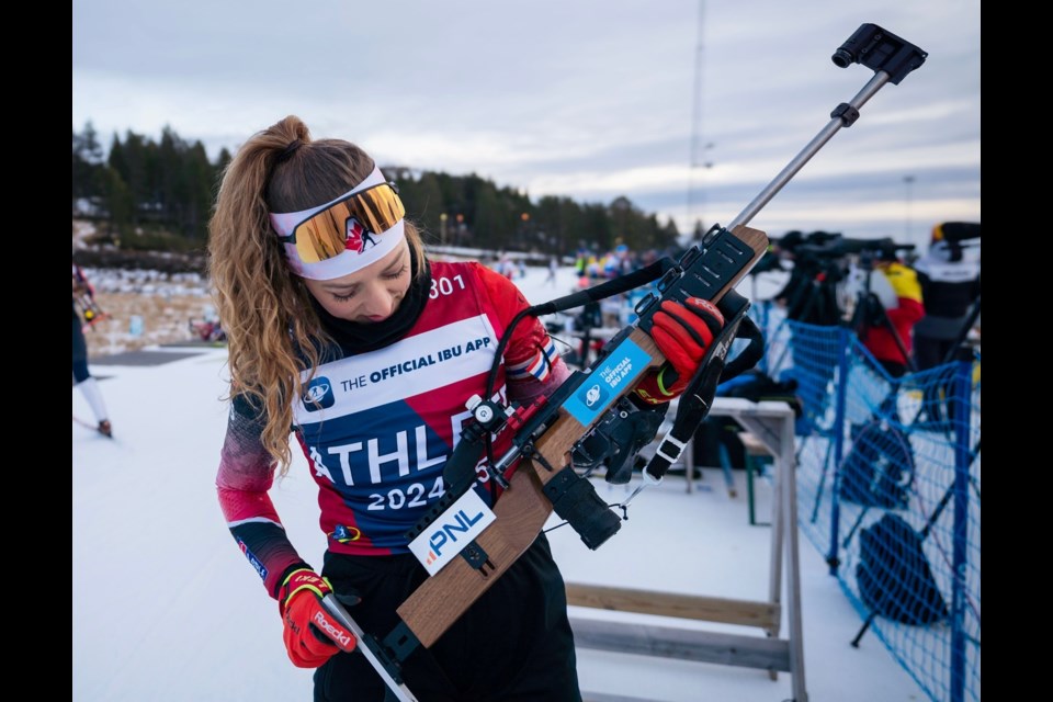 Emily Dickson checks out her rifle on the practice range in Obertilliach, Austria. The 27-year-old from Burns Lake finished 47th out of 92 in Thursday's IBU Cup sprint.