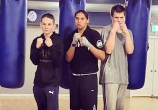 From left, Joshua Greenwood, Thunder Innis and Ben Ruttan get together in advance of Saturday's Champions of the North multi-discipline fight card at the Roll-A-Dome.