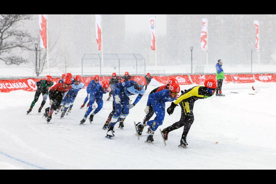 B.C. skater Jack Hanson (20) tucks in behind pack leader Daniel Pauli of Saskatchewan  in Friday's Group B final in the Canada Winter Games mass start long track speed skating race at the Halifax Oval. Hanson,  former Prince George Blizzard Speed Skating Club member who lives in Fort St. John, went on to win the race. 