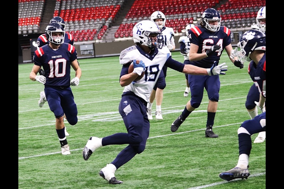 College Heights Cougars receiver Troy Weatherly fights for yards agaonst the Vernon Panthers in Saturday's BCHSFA double-A varsity semifinal at BC Place Stadium in Vancouver.