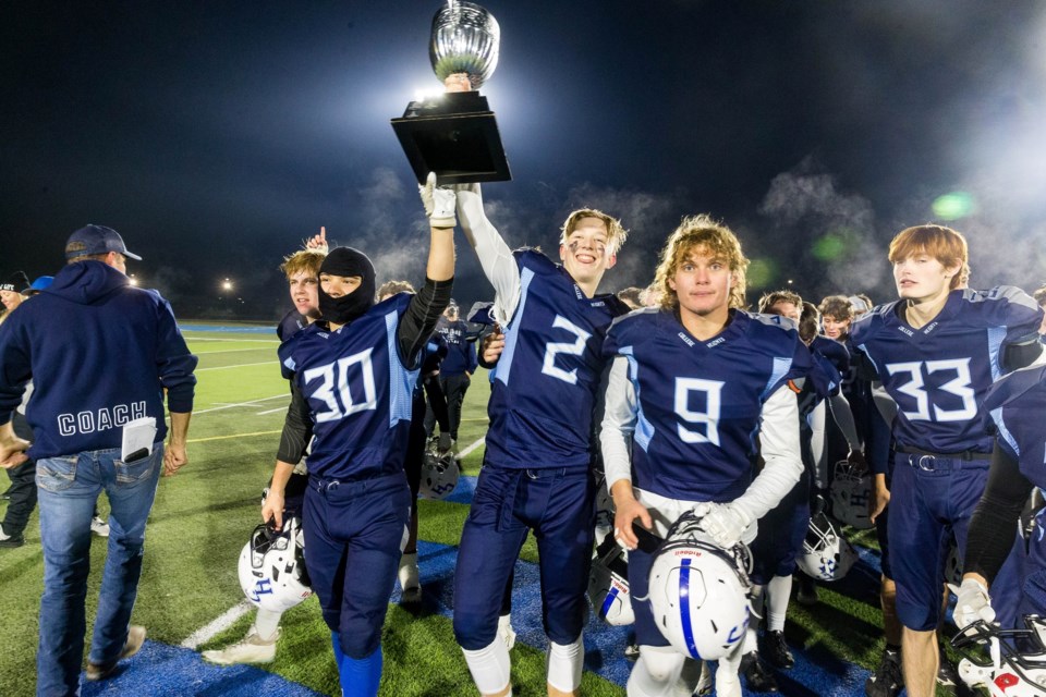 The College Heights Cougars celebrate their 14-7 win over the Nechako Valley Vikings of Vanderhoof in the PG Bowl final Nov. 1 at Masich Place Stadium.