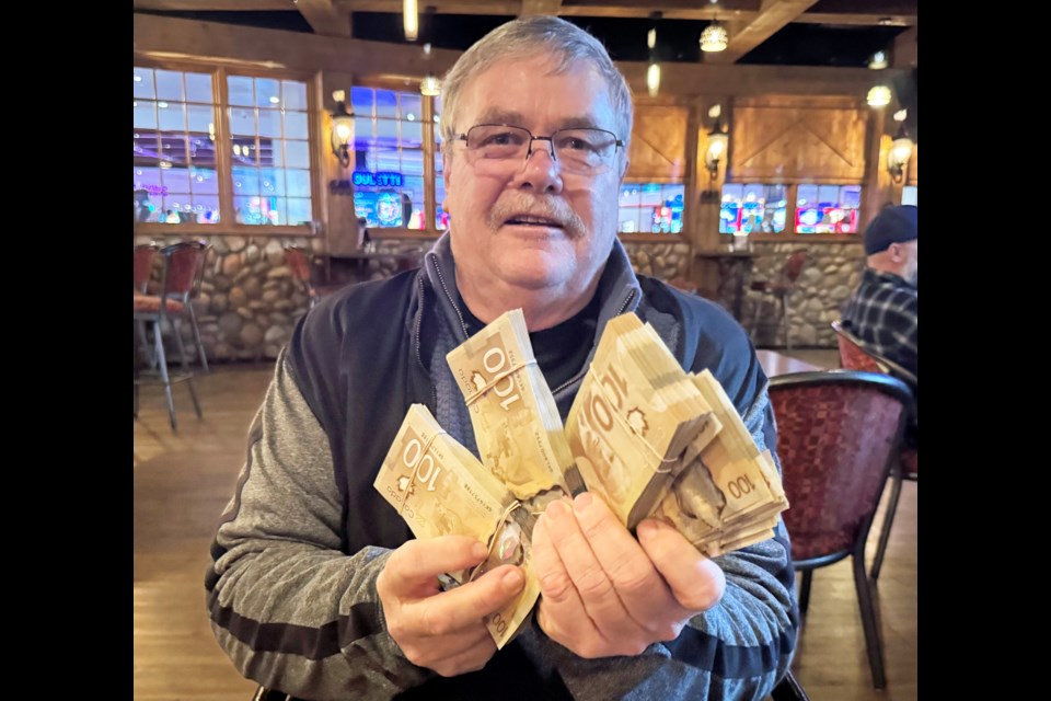 Cal Johnson of Prince George holds the $33,600 he won last weekend at the World Series of Poker seniors event in Calgary on Sunday (Jan.12 2025).