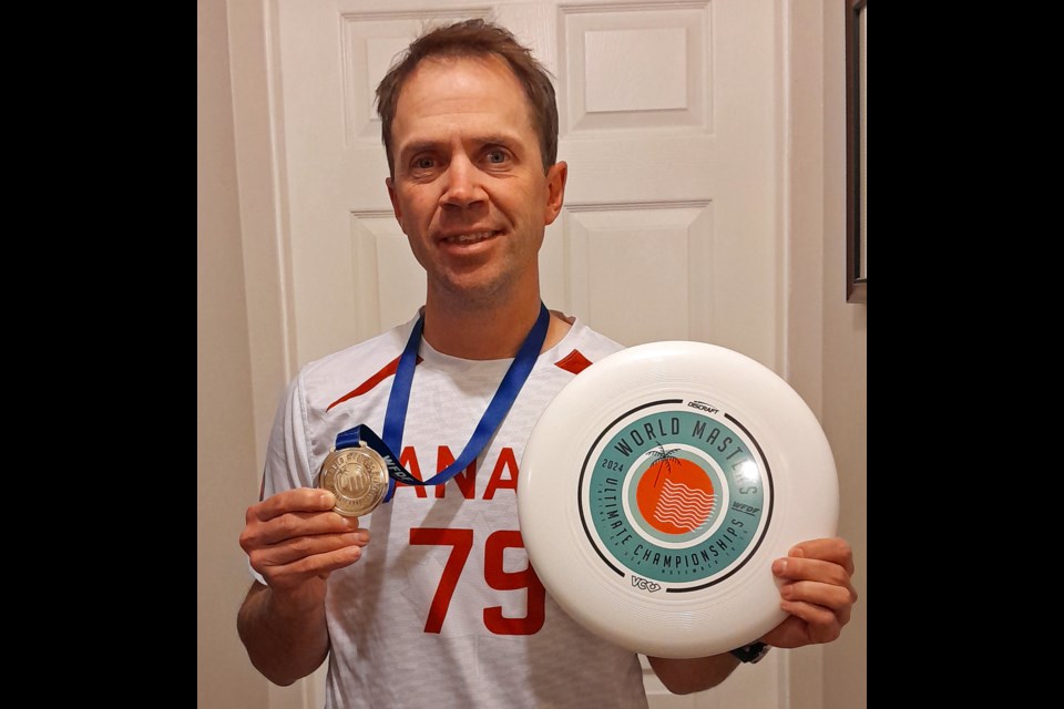 Prince George elementary school teacher Sean Bernard shows off the gold medal he won playing last week for Canada at the World Masters Ultimate Championships in Irvine., Calif.