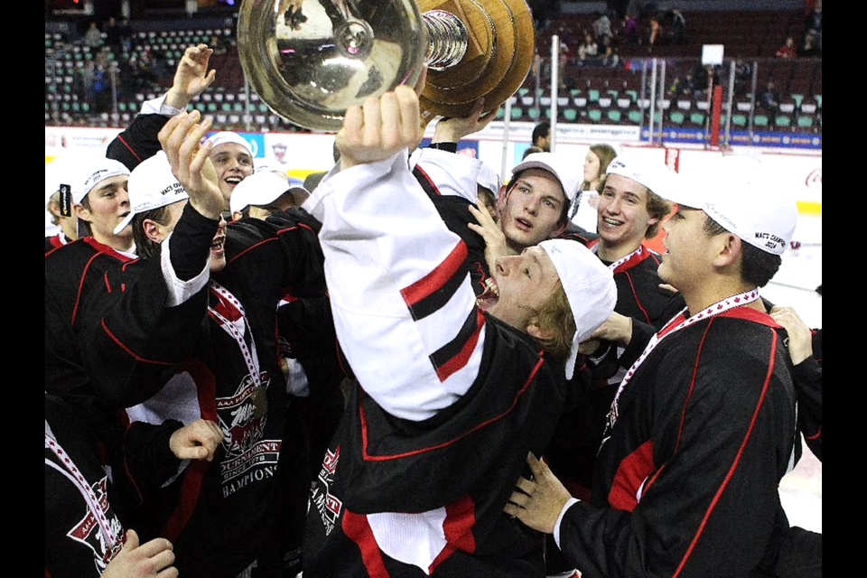 Cariboo Cougars goalie Griffen Outhouse hold the trophy after the Cougars beat Regina Pat Canadians 2-1 in double-overtime to win the Mac's Invitational U-18 hockey tournament in Calgary. Non known as the CIrxle K CLassic, the Cougars return to the tournament for the first time in four years on Dec. 27.