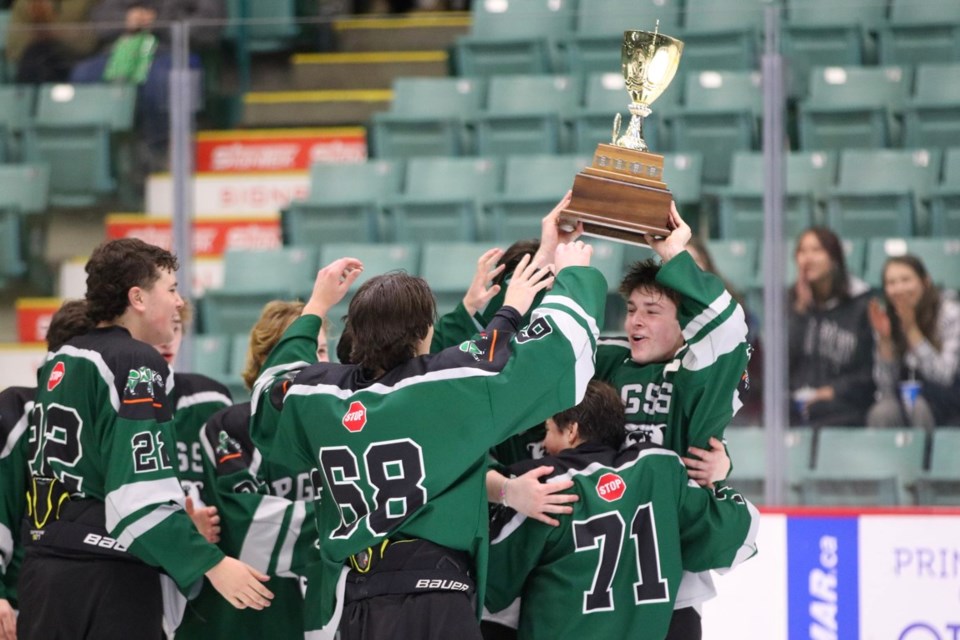 The Prince George Polars celebrate winning the Spirit Game high school hockey title after a 4-2 victory over the College Heights Cougars Friday at CN Centre.