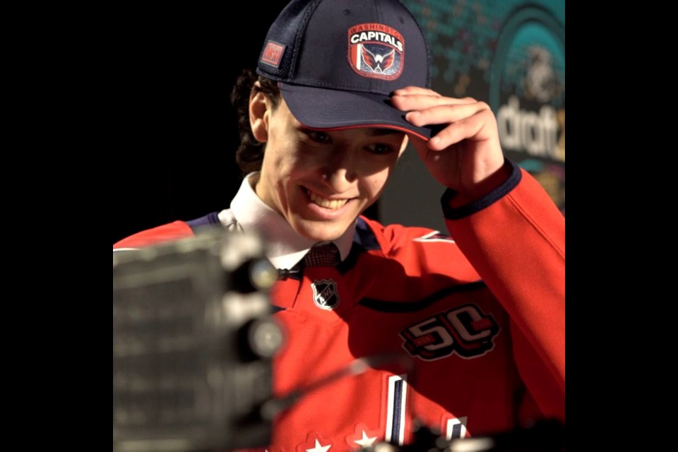 Terik Parascak celebrates on the stage of The Sphere in Las Vegas after he was picked in the first round, 17th overall by the Washington Capitals Friday in the NHL Draft.