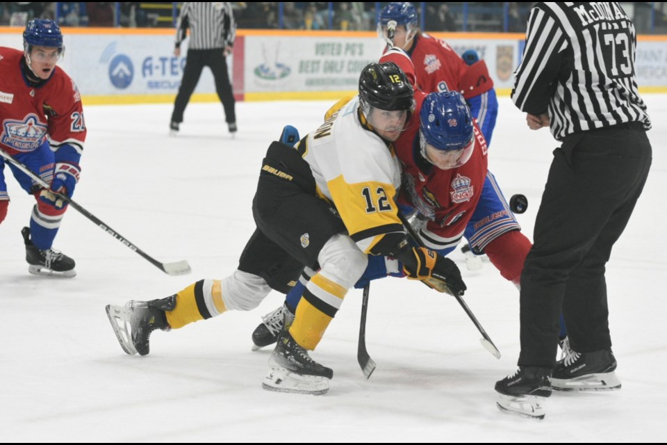 Spruce Kings centre Owen Goodbrand battles for the puck with Coquitlam Express centre James Shannon during their game Saturday at Kopar Memorial Arena. The Kings won 3-2 to complete a two-game BCHL weekend sweep. 