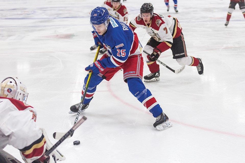 Citizen Photo by James Doyle. Prince George Spruce Kings forward Nick Rheaume goes one-on-one against West Kelowna Warriors goaltender Johnny Derrick on Wednesday evening at Rolling Mix Concrete Arena. 