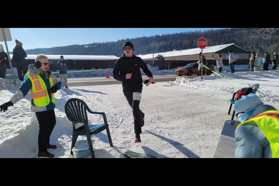 Adam Flett completes the five-kilometre run from the ice oval to Prince George Aquatic Centre for the Bluer Balls mixed relay team the Prince George Iceman on Sunday, Feb. 11, 2025. Bluer Balls posted the fastest overall adult relay time, finishing in 1:49:56.1. The other team members were Liam Connon, Thomas Ginter, Nathan Romanin and Alexandria Hedges.