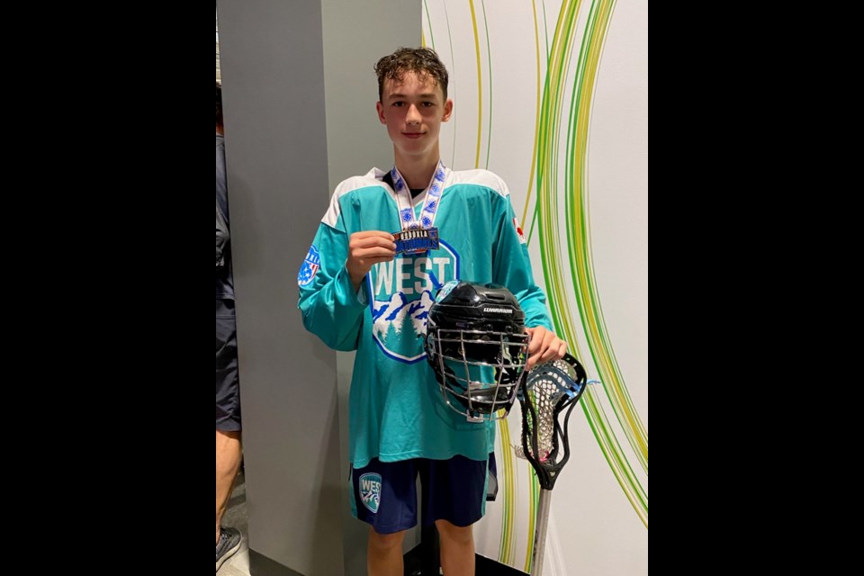 Garrett Sakamoto of Prince George holds the gold medal he earned playing for Fusion West at the 2021 U.S. Boxla Nationals Aug. 8 in San Jose, Calif. The 13-year-old from Prince George scored two goals in the Bantam A final, an 8-4 win over Denver.