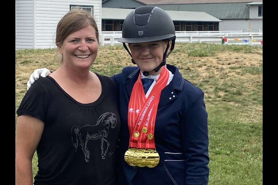 Azlyn Ryan, 16, right, is seen here with her coach, Susie Palley, as she takes a moment to show off her medals as she took top spot in the BC Summer Games in dressage last season. Azlyn is also the BC Rising Stars Youth Dressage Champion.