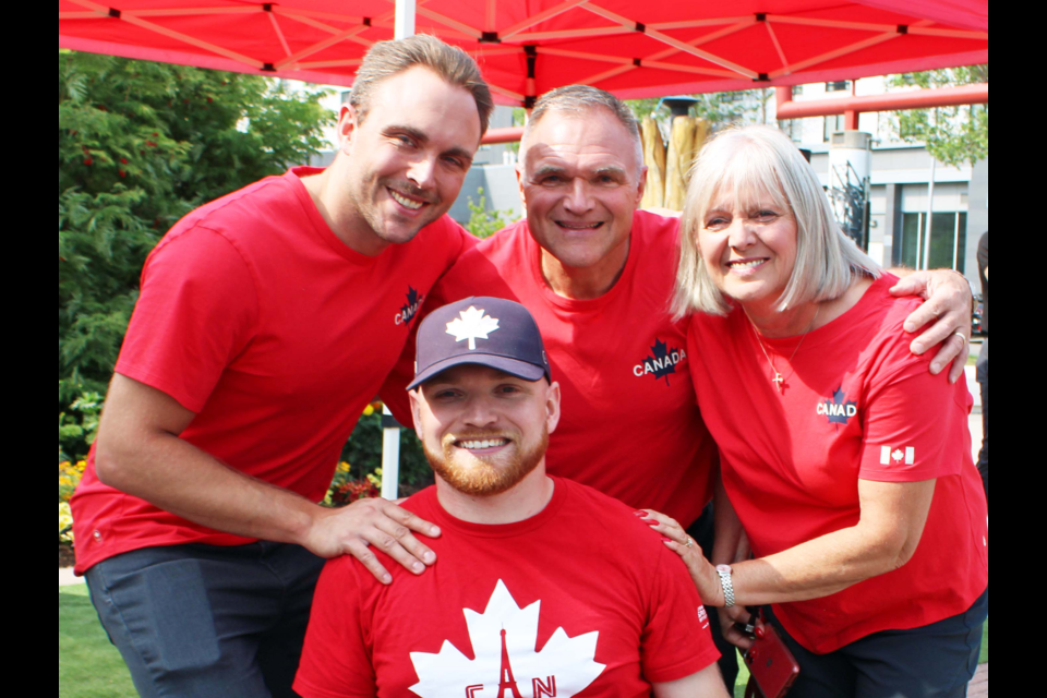 Flanked by his brother Carl and parents Jim and Bonita, Joel Ewert met with a crowd of well-wishers who gathered Friday morning at Canada Games Plaza for his Paralympics sendoff to Paris.