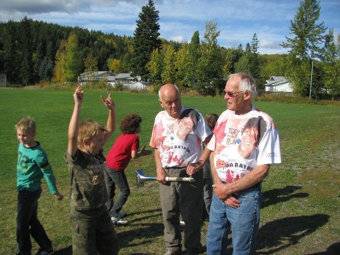 Dick Voneugen holds his trademark horn with Tom Masich, co-organizers of the Terry Fox Run on Oct. 3, 2011.