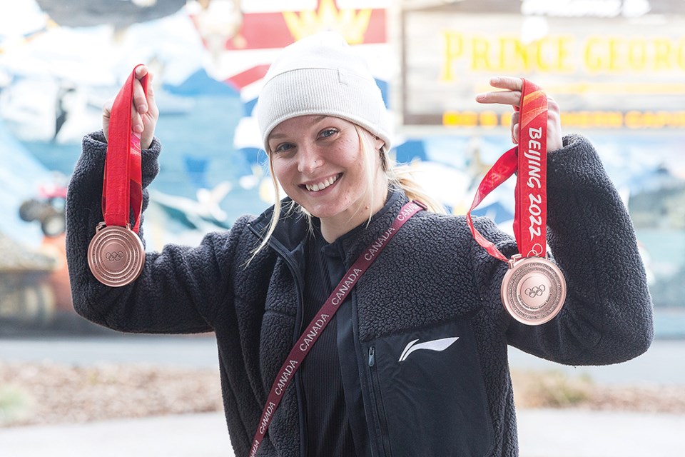 Citizen Photo by James Doyle. Two-time Olympic bronze medal winner Meryeta O'Dine shows off her new medals upon her arrival in Prince George on Tuesday afternoon.