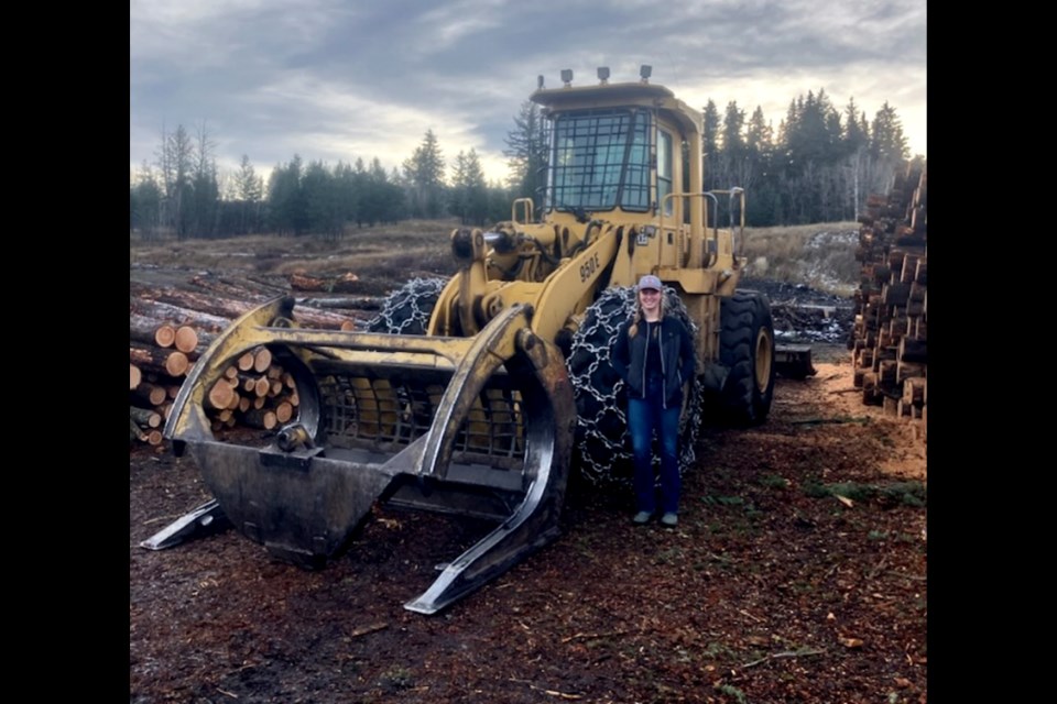 UNBC soccer goalie Brityn Hinsche is back on the job during Christmas break running a loader for her dad's logging company in Williams Lake. Hinsche has drawn the interest of a semipro soccer team in Limerick, Ireland which could lead to a paid goalkeeping  position for the 21-year-old this year in the Emerald Isle.