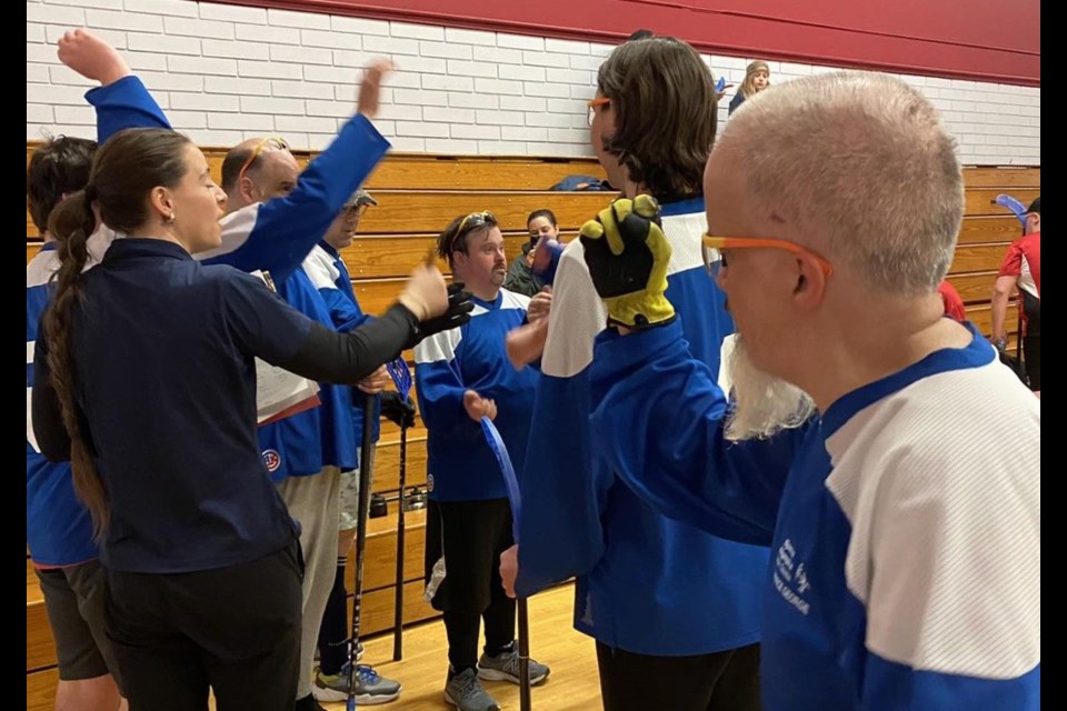 The Prince George Special Olympics floorball team give a cheer during the tournament held in Kelowna on March 15, 2025.