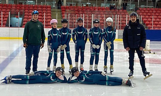 Blizzard coach Nolan Vansickle, left, and guest alumni coach Nico Hiller, left, pose for a photo with some of the Prince George Blizzard Speed Skating Club racers who will be in action this weekend at the BC short track championships at Kin 1. 