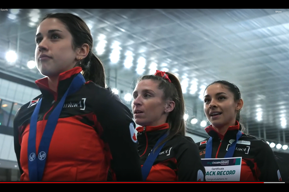 Carolina Hiller of Prince George, right, stands on the podium in Hachinohe, Japan with Canadian sprint teammates Baeatrice Lamarche, left and Ivanie Blondin after they won the Four Continents title in track record time.