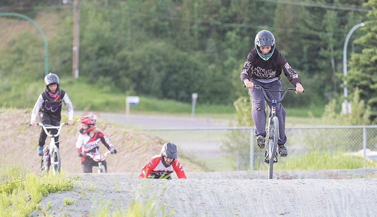 Riders make their way around the Supertrak BMX track during the first practice of the season in 2017. Citizen file photo