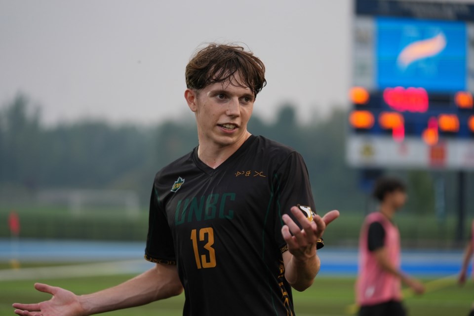 UNBC's Isaac Tate doesn't mind the rain win Kamloops, where he and his Timberwolves teammates walked off with a 1-0 Canada West win over the Thompson Rivers University WolfPack.