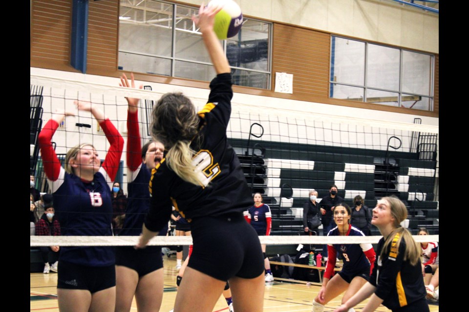 Duchess Park Condors left-side hitter Avery Parker swats the ball into the D.P. Todd Trojans' backcourt during the gold-medal match Saturday at the PGSS senior girls volleyball tournament.