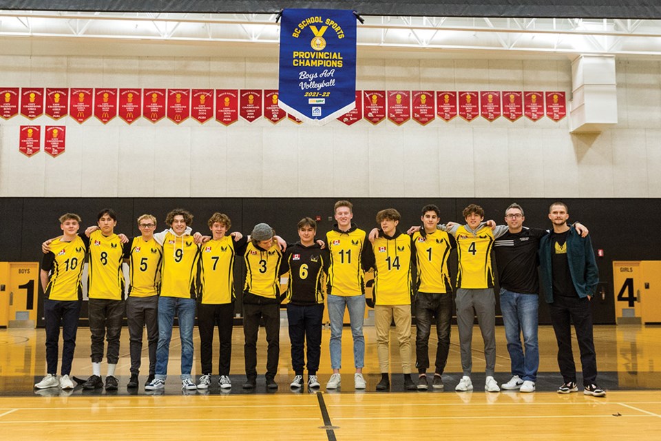 Citizen Photo by James Doyle. Duchess Park Condors senior boys volleyball team poses their banner on Wednesday afternoon at Duchess Park gymnasium during a ceremony to celebrate their team's recent provincial volleyball championship.