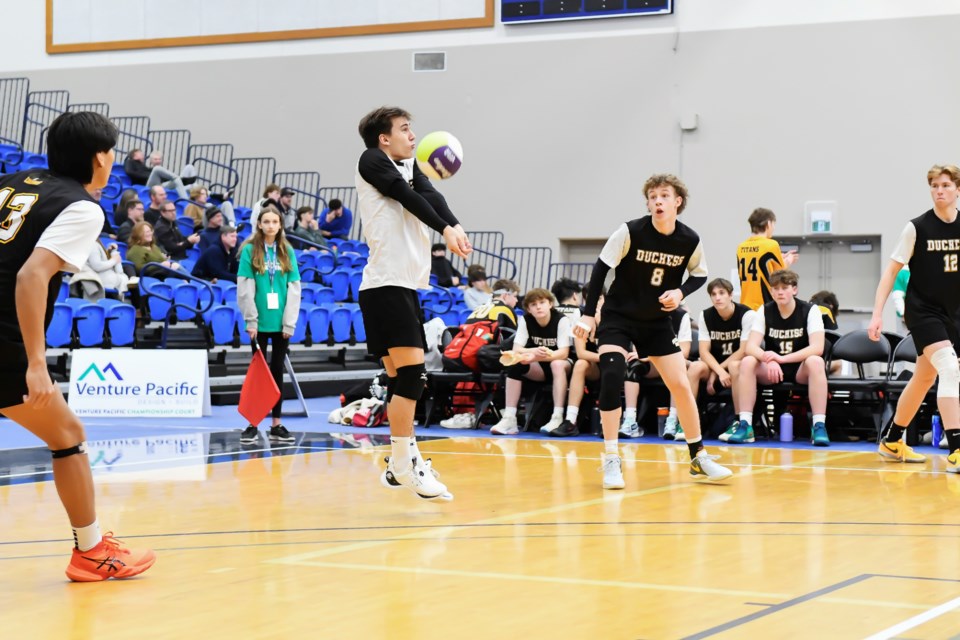 Finn Blair of the Duchess Park Condors keeps the ball alive during a game against Windermere at the double-A boys high school volleyball provincial championship in Langley.