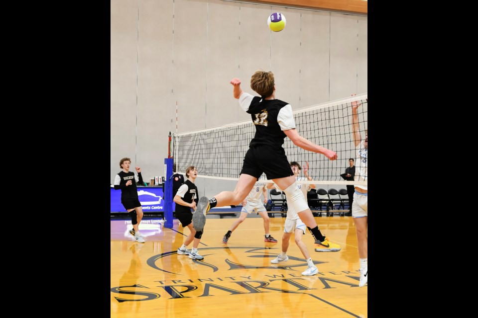 Theo Clarke of Duchess Park Condors delivers a spike during their match against Windermere at the double-A provincial volleyball championship in Langley.