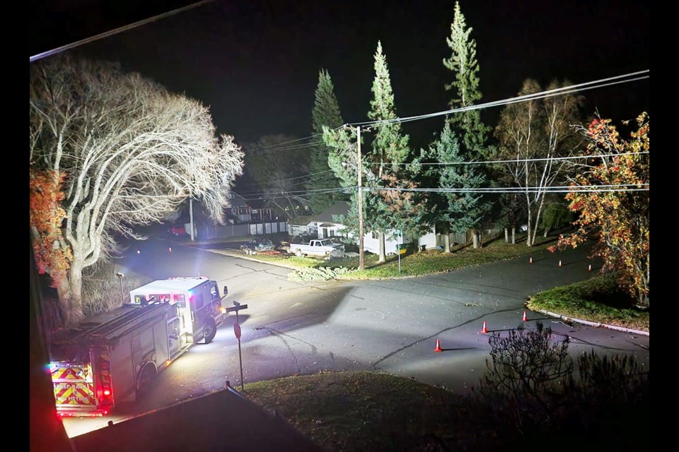 Firefighters respond to the scene of a tree that fell onto a hydro line on Hemlock Street early Thursday morning. Prince George was one of the hardest-hit areas of the storm, which packed wind gusts of 90 km/hr.