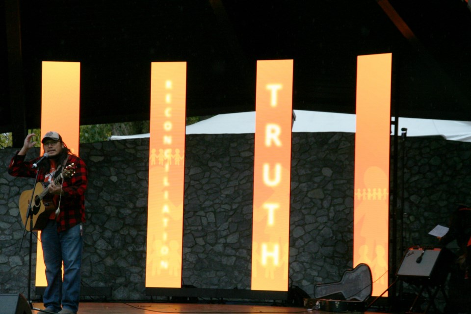 Singer-songwriter Joel West performs during a gathering to mark National Day for Truth and Reconciliation at Lheidli T'enneh Memorial Park on Monday, Sept. 30, 2024 in Prince George, BC. 