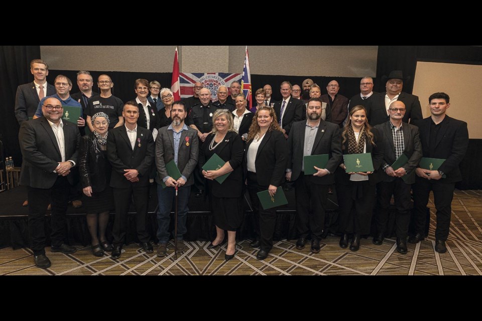 MP Todd Doherty poses with the recipients of the King Charles III Coronation medals on Sunday, March 9, 2025 at the Courtyard by Marriott hotel in Prince George, BC.