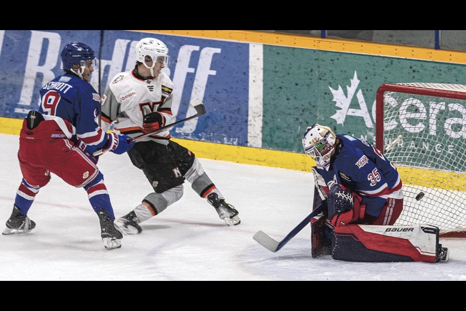 The Nanaimo Clippers' Cole Lonsdale fires the overtime game winning shot past Spruce Kings goalie Ryder Green Saturday at Kopar Memorial Arena.