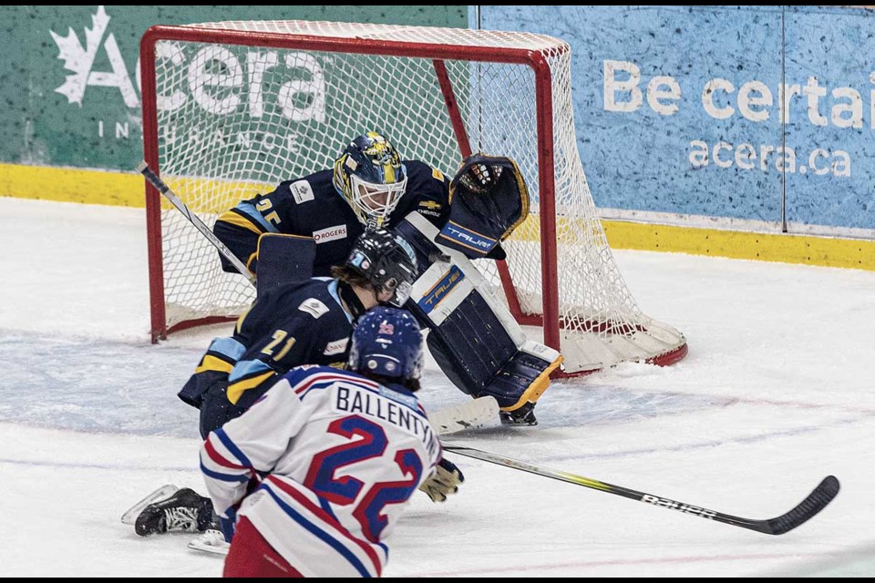 Spruce Kings #22 Trent Ballentyne's shot rises on course to find the back of the net over Spruce Grove goalie #35 Ryan De Kok's left shoulder opening the scoring at 14:02 of the first period Saturday at Kopar Memorial Arena.