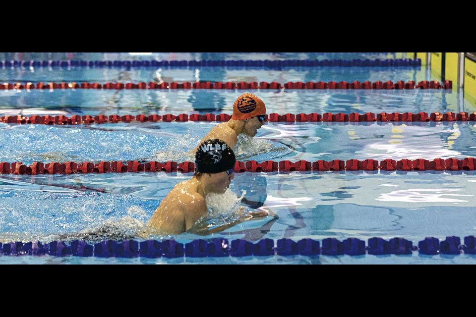 Prince George Barracudas swimmer Eric Humphreys bounces back in the final leg of the 200m breaststroke Sunday to beat Williams Lake Blue Fins Jasper Bird at the Mr. Lube Invitational held at the Aquatic Centre over the weekend.