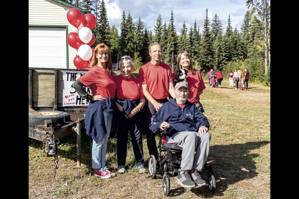 Members of Team Stinson, Laurisa (left), mother Iris, Mitch, father Don, Mitch's partner Wendy Busse and dog Tippy gather together before starting the five-kilometre walk to celebrate their successful fundraising drive, raising over $20,000, in memory of brother/son Malcolm Stinson. Malcolm, who succumbed to the disease after a 14-year fight on Oct. 18, 2023 at age 63, famously completed 30 half-Ironman-distance races in July 2017 at the age of 57 while undergoing chemotherapy.