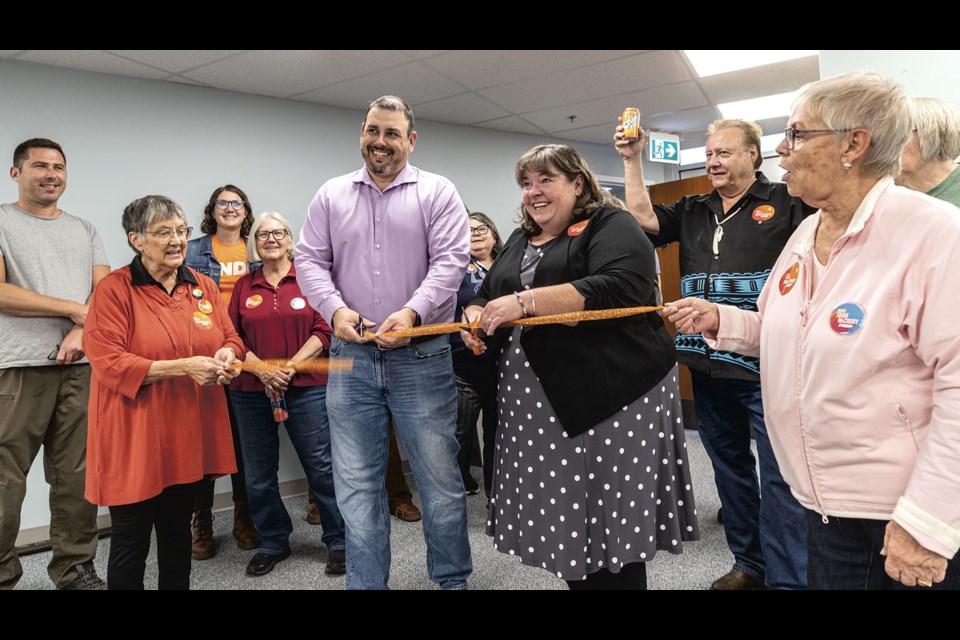 BC NDP candidate in Prince George-Valemount Clay Pountney, former chief of the Lheidli T'enneh First Nation, and BC NDP candidate in Prince George-Mackenzie Shar McCrory, a trustee in School District 57, cut a ribbon to open their downtown campaign office Monday.