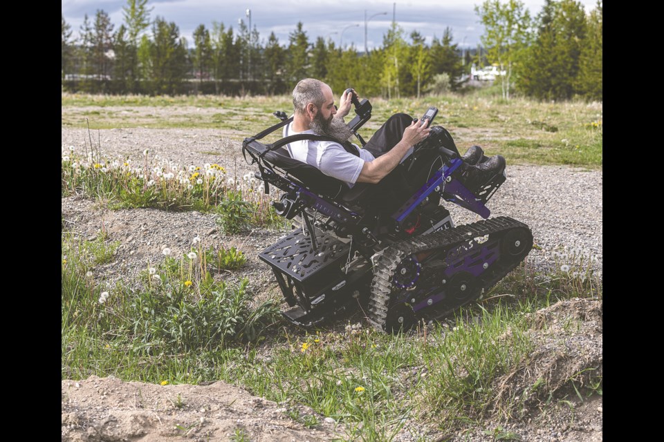 Ryan Purves, 47, explores the exhibition grounds behind the Kin Centres on the Axis, an all-terrain mobility chair made by Action Trackchair on Friday, May 24, 2024 during the Prince George Rod and Gun Club 2024 Gun and Sportsman Show at Kin 1 and 2 at Exhibition Place in Prince George, BC. 
