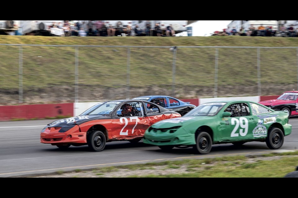 Brandon Verkaik #29 tries to make a pass though the inside of Sierra Trenholm #27 as they enter turn three during Hornet class racing action at PGARA Friday.