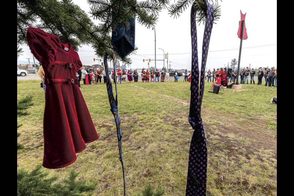 This year, for the first time,  the ceremony at the Red Dress monument also featured ties to represent missing and murdered men as well as women.