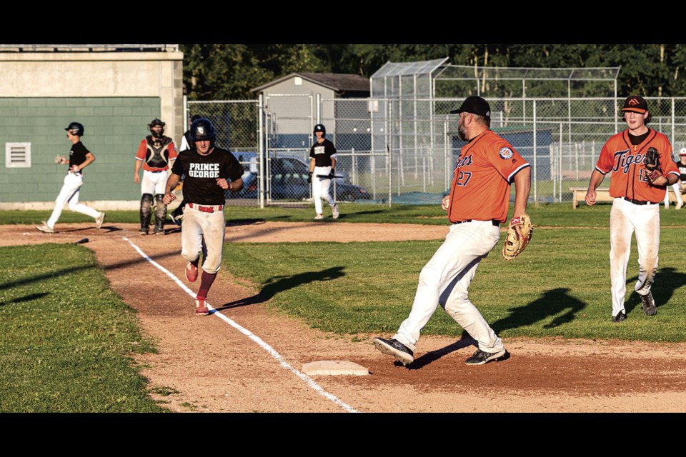 Adam Leslie of the Pomeroy Inn & Suites Knights got an RBI but was tagged out at first base by Adam Norn of the PG Plumbing & Heating Tigers during their game Thursday evening at Citizen Field. The Tigers took the senior baseball contest 9-5 after scoring seven runs in the fifth inning.	