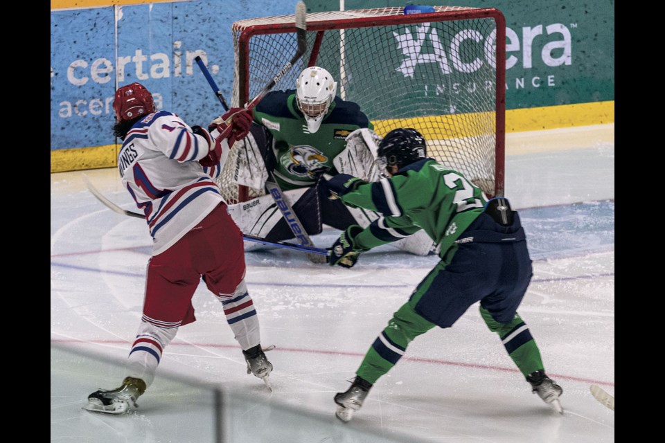 Spruce Kings forward #11 Brock Cummings fires a puck into the chest pad of Surrey Eagles goalie #1 Maddox Osaka during Saturday's 6-3 win at Kopar Memorial Arena. 