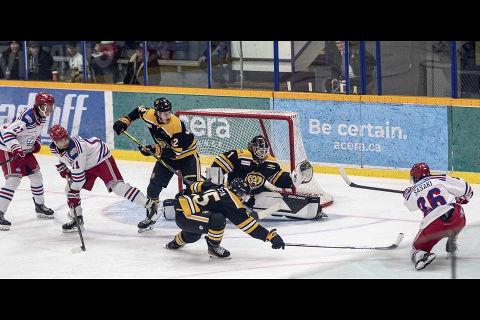 Spruce Kings forward #26 Kazumo Sasaki buries his shot past Victoria Grizzlies goalie Tyler Hodges to open the scoring Saturday at Kopar Memorial Arena.