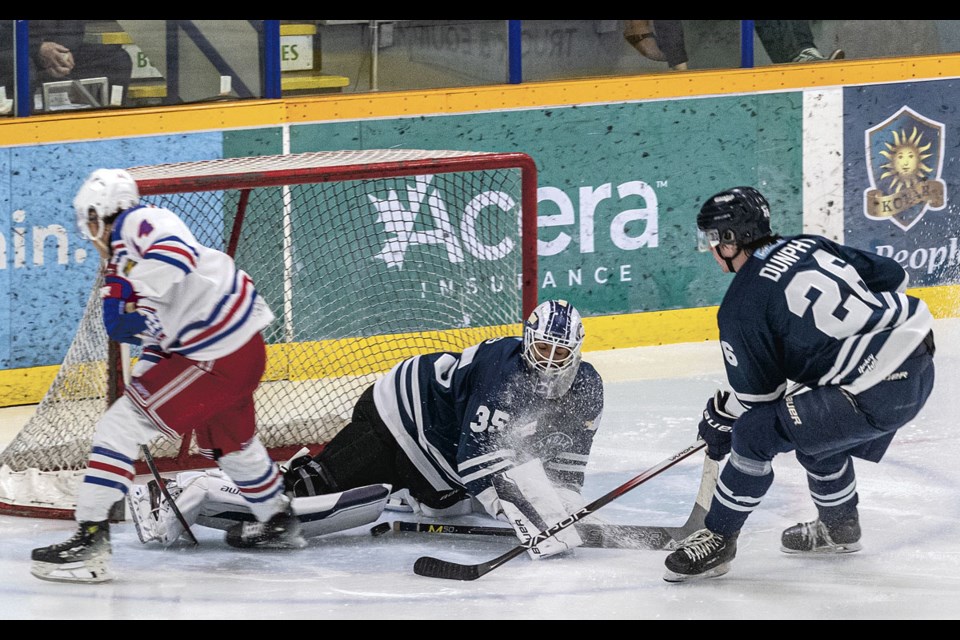 Langley Rivermen goalie Bodee Weiss stops Spruce Kings defense man Jayden Connors' shot Friday during their preseason game at Kopar Memorial Arena.