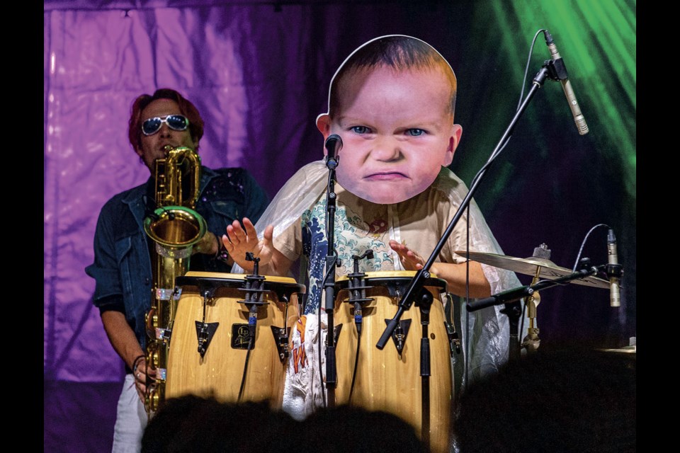 Five Alarm Funk's congo player/vocalist Tom Towers went through a number of costume changes, including masks, during Crossroads Street Fest on Saturday, Sept.7, 2024 in Prince George, BC.  The night also featured Crones and headliner Five Alarm Funk.