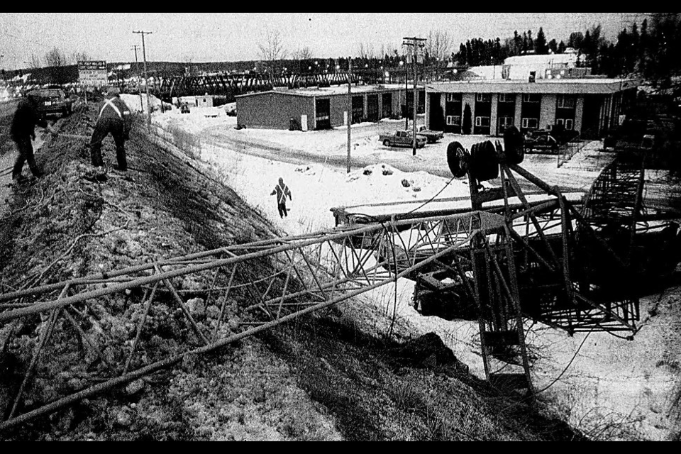 Dec. 19, 1994: BC Hydro crews had to clear away downed power lines after a crane toppled over on Ongman Road. Not seen in this photo is the Christmas tree the boom had suspended, which ended up on the ditch on the other side of the road. The lit-up tree was a striking sight for years, as in the dark it appeared to be floating in midair. 