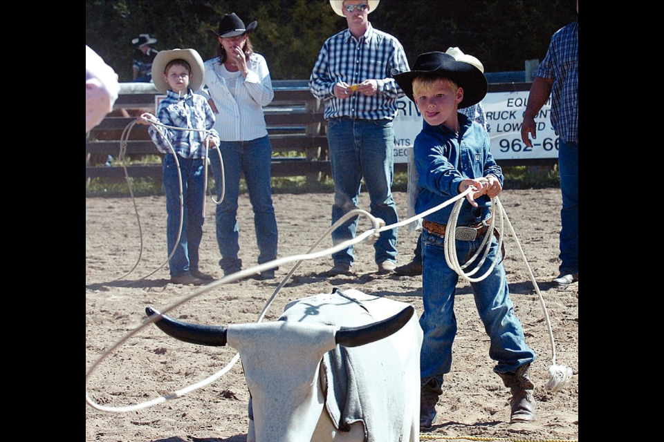 Aug. 22, 2011: Clay Farmer, 6, from Savona, concentrates on his roping during the Junior Boys Dummy Roping competition at the B.C. Little Britches rodeo. Clay placed sixth in the event.