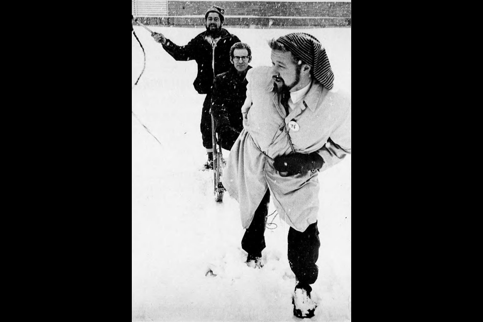 Jan. 22, 1971: ‘Mush,’ cries Derk Albers of Horsefly as Winter Carnival president Con Nostwold strains against the harness to give Art Warburton a practice sled ride. Carnival organizers rejoiced over the snow falling in Prince George, just in time for the carnival, which ran until Jan. 31. 